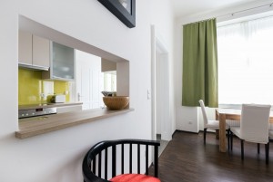 Living room with green curtains in accommodation Vienna