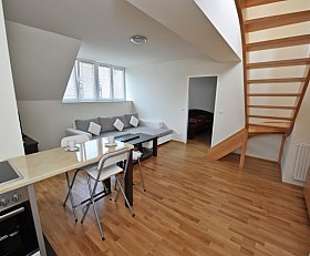 Living room with parquet flooring and stairs